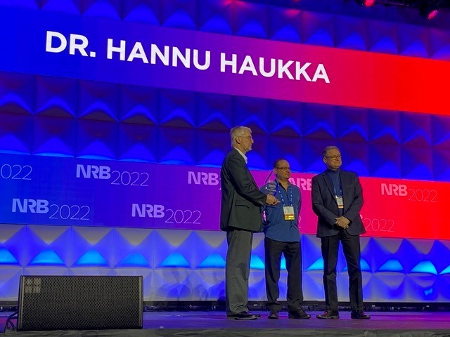 Dr. Hannu Haukka At Right Receiving the NRB 2022 International Media Award