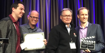 Trinet’s CEO John Carley (at left) and Greg Sukert, Trinet’s webinar host (at right) presenting the Videographer Award to Dr. Hannu Haukka (center right) and Dave Ogren (center left) at the Connect PDX Evangelism conference in Portland, OR on Sept 18, 2019